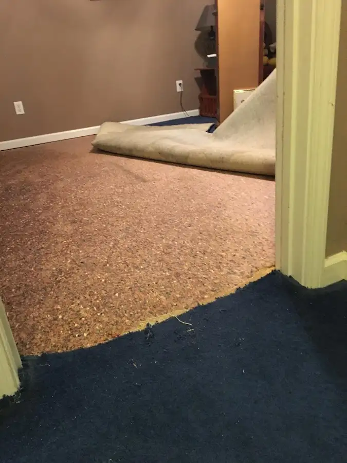 Carpet pad removal revealing water damage during Drying & Dehumidification in Pukalani